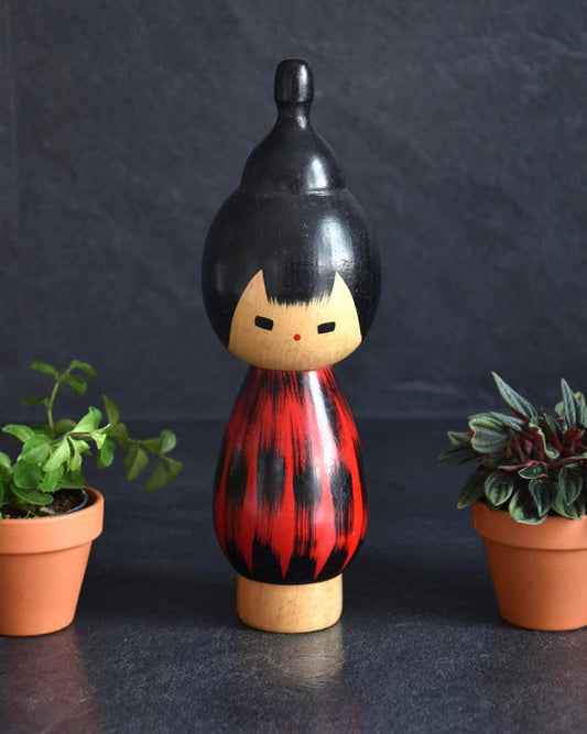 Hideo Ishihara Yukake Red Sunset Kokeshi doll featuring hand-carved bamboo stalks and red background