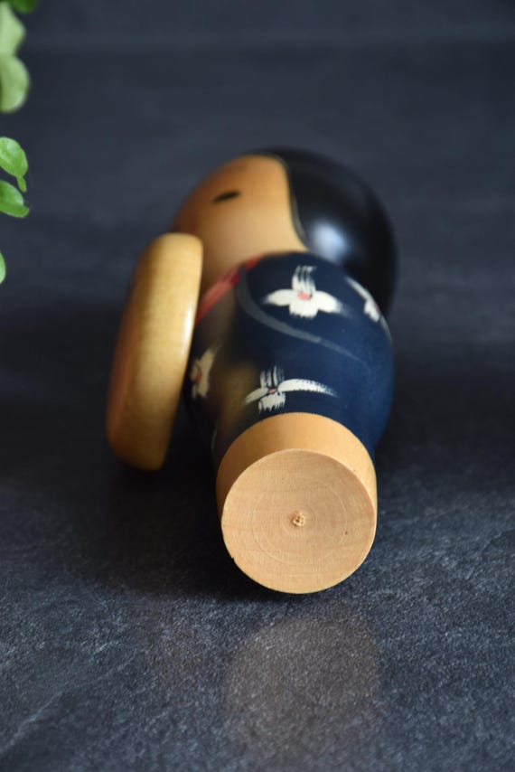 Miyashita Hajime kokeshi doll bottom base view showing the natural wood finish and turned shape