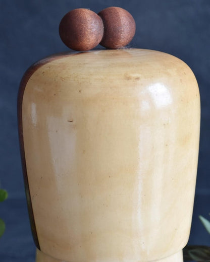 Kojo Tanaka Sosaku Kokeshi doll top showing two-sphere ornament on head