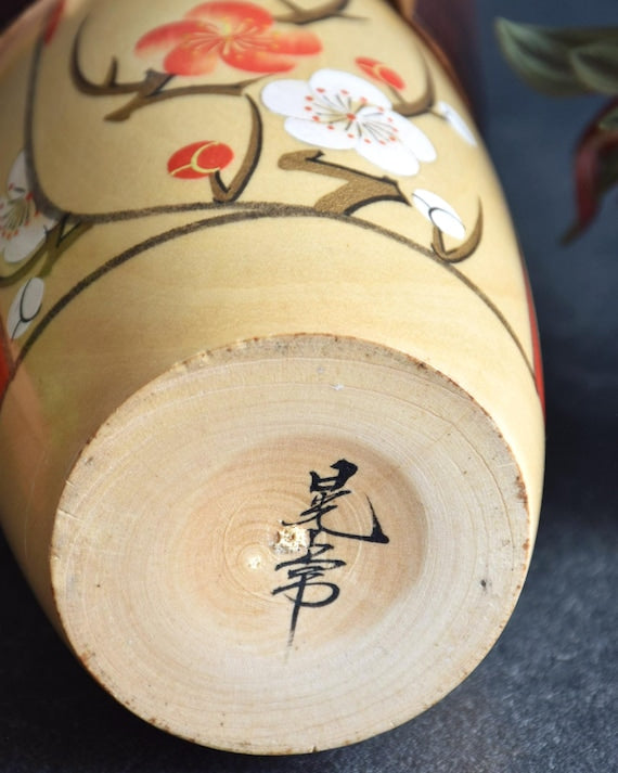 Kojo Tanaka Sosaku Kokeshi doll base showing artist signature in black ink
