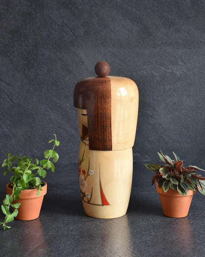 Kojo Tanaka Sosaku Kokeshi doll showing side profile and wooden texture