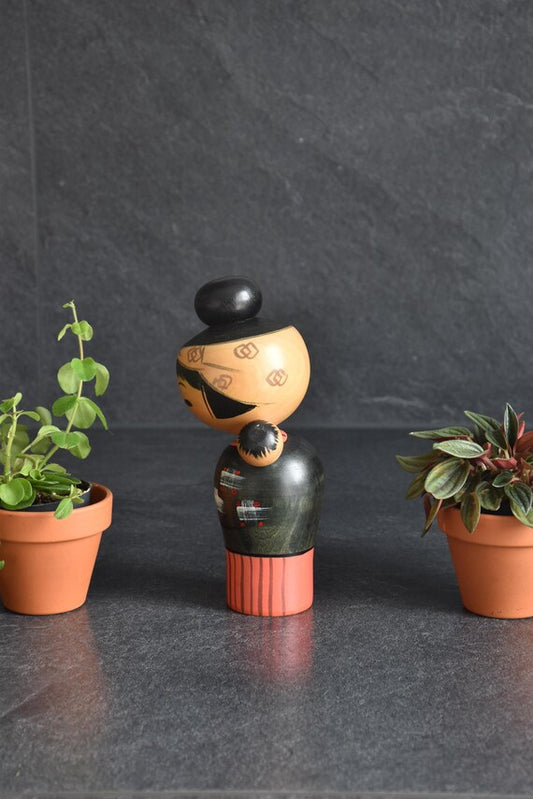 Hajime Miyashita Oshin Lullaby Kokeshi wooden doll showing mother carrying child on back