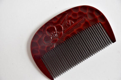 Kamakura-Bori Plum Blossom Comb angled view highlighting textured lacquer finish