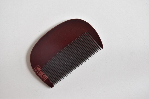 Kamakura-Bori Plum Blossom Comb back side displaying red maker seal