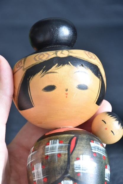 Hajime Miyashita Oshin Lullaby Kokeshi close up of painted face and child