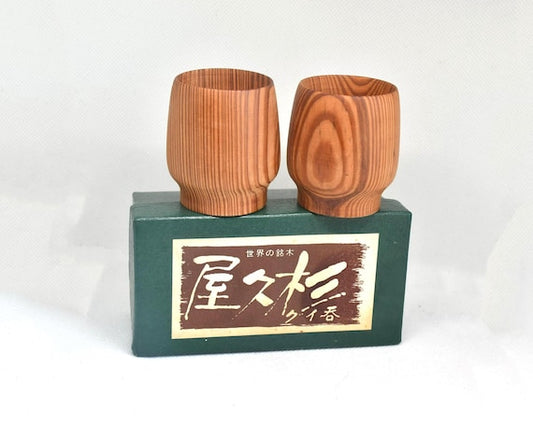 Yakusugi Cedar Sake Cups handcrafted from ancient cedar of Yakushima island, presented on their original green box