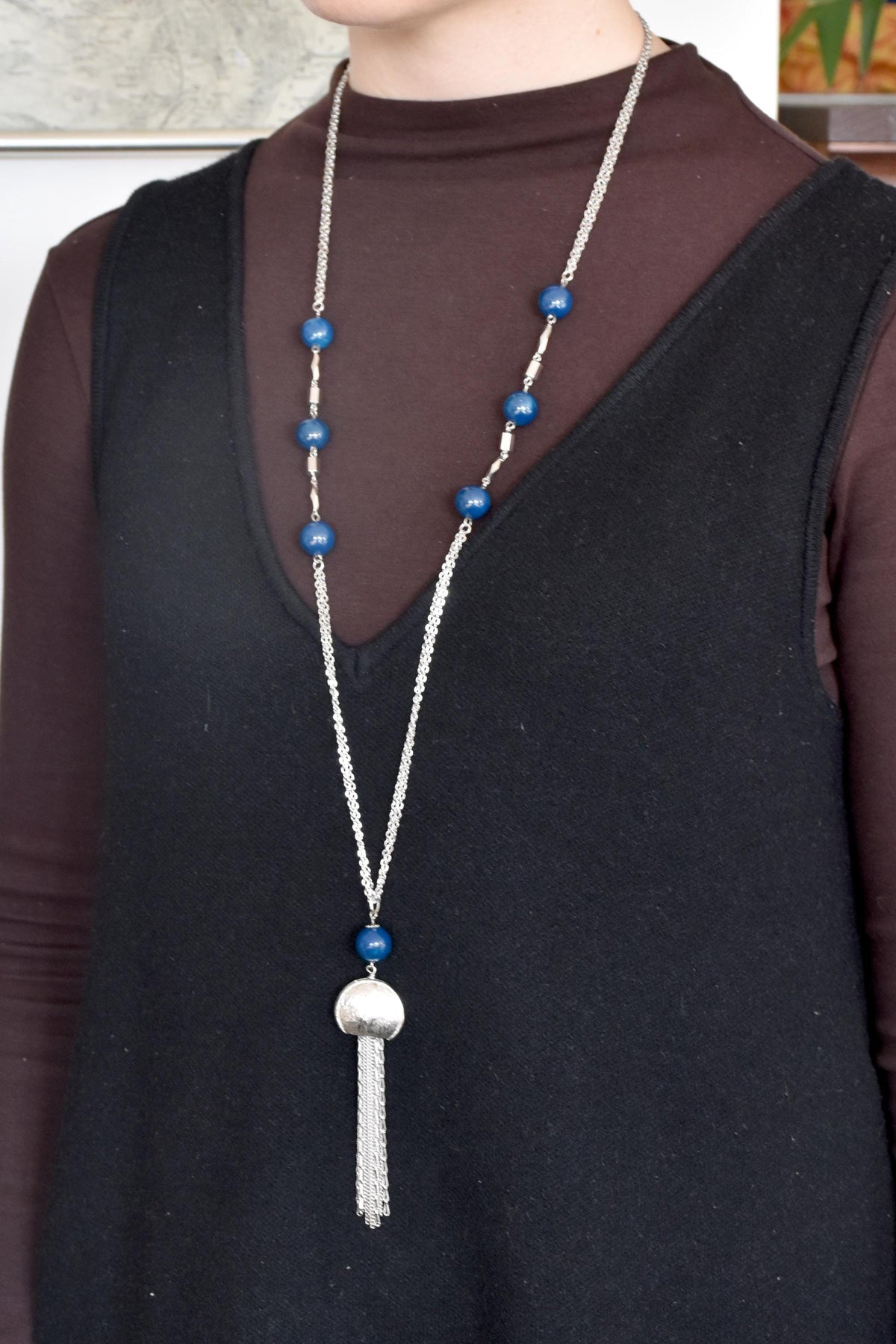 Rakuho Half-Moon Pendant Necklace With Blue Beads worn on a person for scale