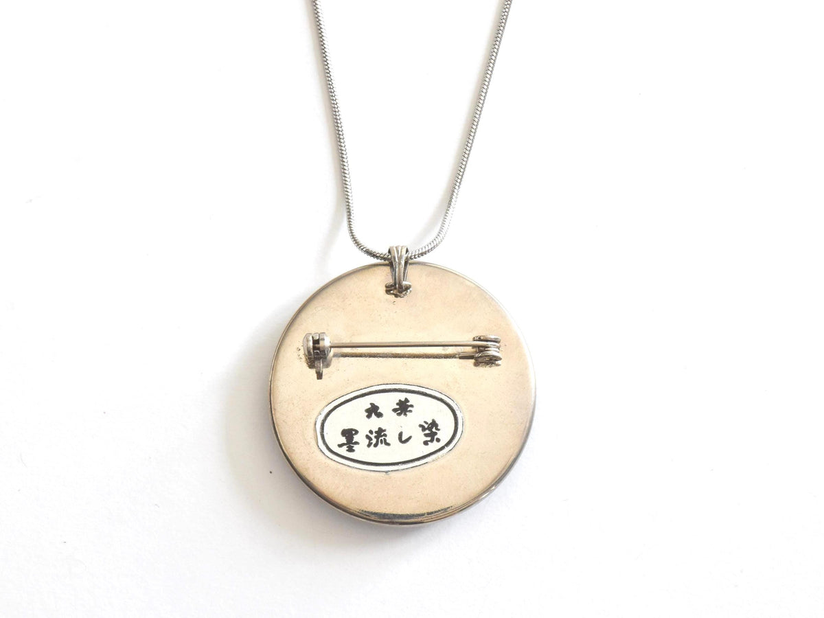 Suminagashizome marbled fabric necklace showing back with pin clasp and Japanese kanji inscription