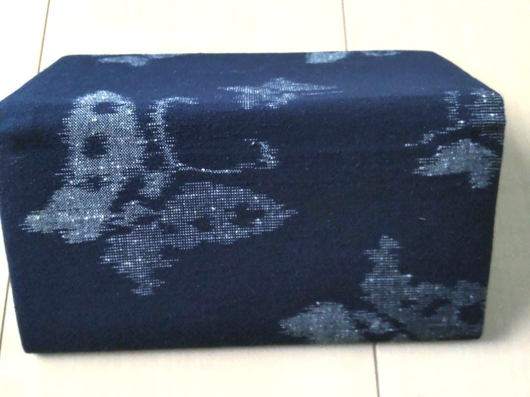 Indigo Kasuri coin purse close-up view showing the textured butterfly pattern