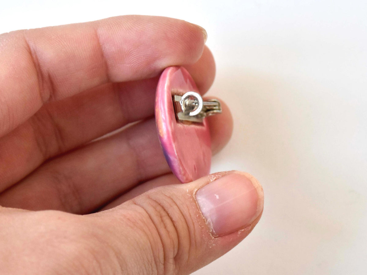 Kutani ceramic brooch held sideways showing depth and pin clasp