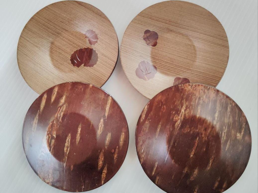 Kabazaiku Birch Bark Coasters With Seasonal Motifs showing the patterned front and plain bark back