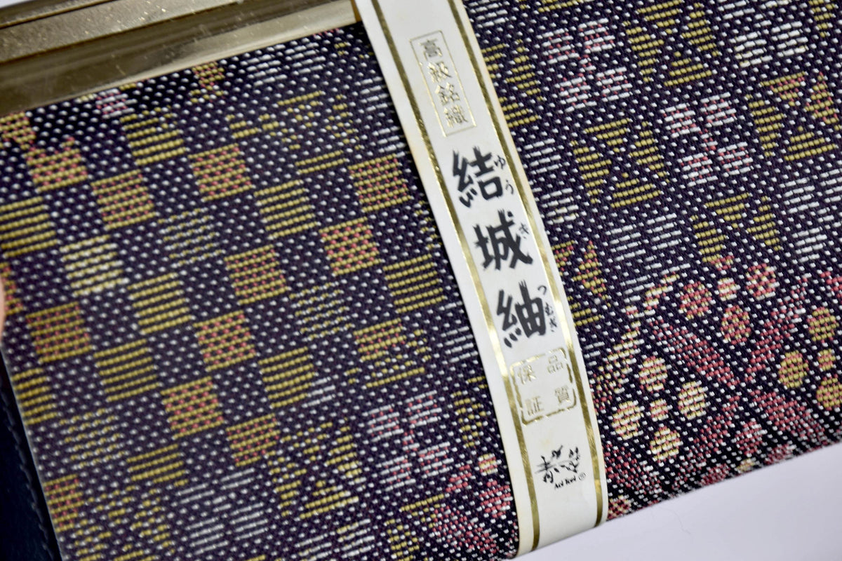 Yūki-Tsumugi Silk Gamaguchi Purse closeup of geometric silk pattern