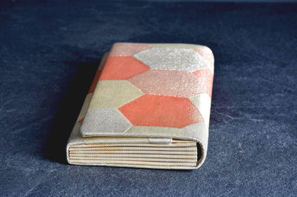 Nishiki Weave Geometric Obi Clutch Bag side view showing the pleated accordion gusset