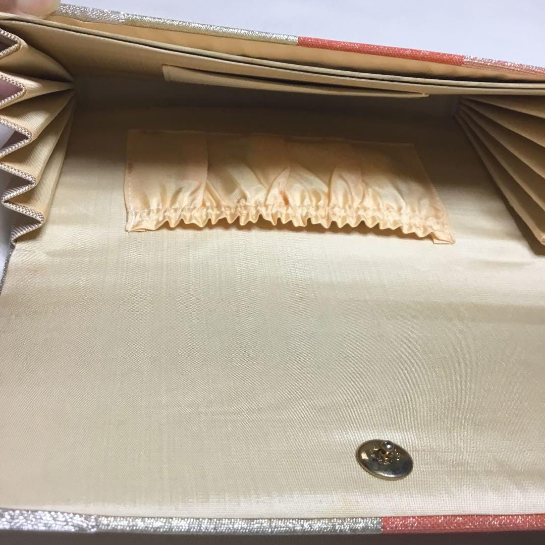 Nishiki Weave Geometric Obi Clutch Bag inside showing silk lining, multiple compartments and elastic pocket