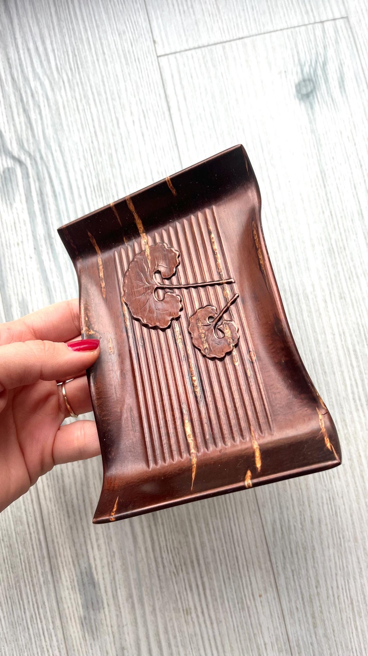 Kabazaiku Cherry Bark Plates Ginkgo Motif Serving Tray shown next to a hand for scale