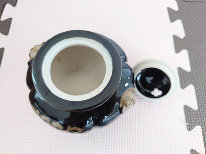Kutani-Yaki Black Glaze Lion Finial Tripod Koro open with the lid removed revealing the interior