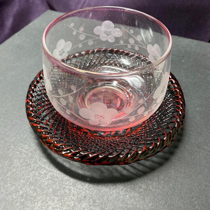 Floral Etched Glass And Rantai Shikki Bamboo Tea Set glass cup with floral etching resting on a bamboo coaster