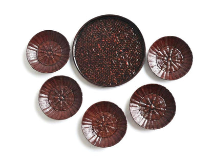 Rantai Shikki woven bamboo lacquer tray and five small plates arranged together on white
