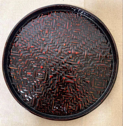 Rantai Shikki woven bamboo lacquer tray showing glossy reddish-brown urushi finish