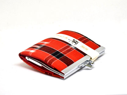 Kasuri Fabric Gama-Guchi Wallet angled view showing metal clasp and red plaid pattern