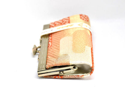 Hakata-Ori Silk Gamaguchi Coin Purse side view highlighting the slim profile, metal frame, and clasp mechanism.