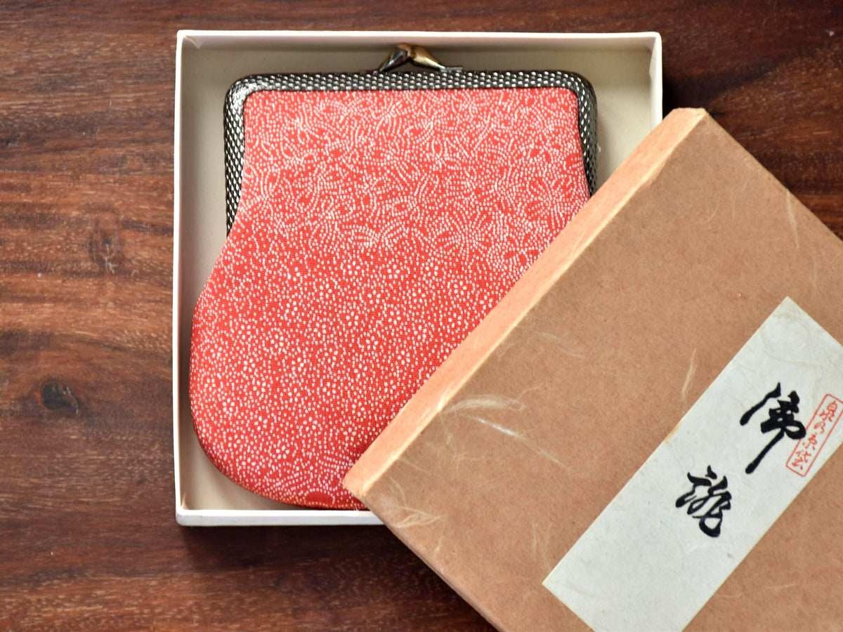 Red Silk Kimono Textile Clasp Coin Purse partially nestled inside the open presentation box with the lid placed nearby