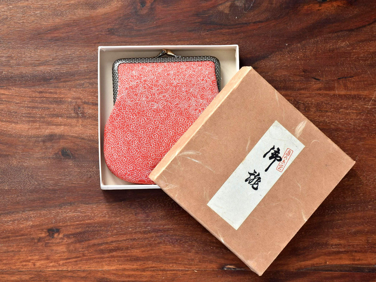 Red Silk Kimono Textile Clasp Coin Purse resting inside its open white presentation box next to the textured cover box