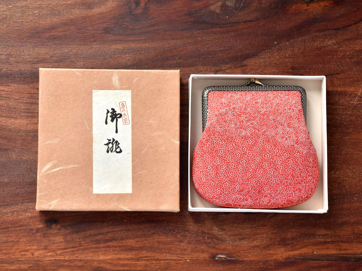 Red Silk Kimono Textile Clasp Coin Purse displayed neatly inside the white box tray next to the upright presentation lid