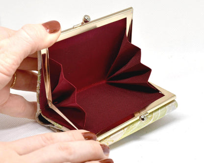 Nishijin-Ori bamboo leaf brocade coin purse gold green open showing structured accordion coin section