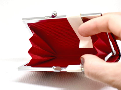 Kasuri Fabric Gama-Guchi Wallet wide open interior being pinched by fingers