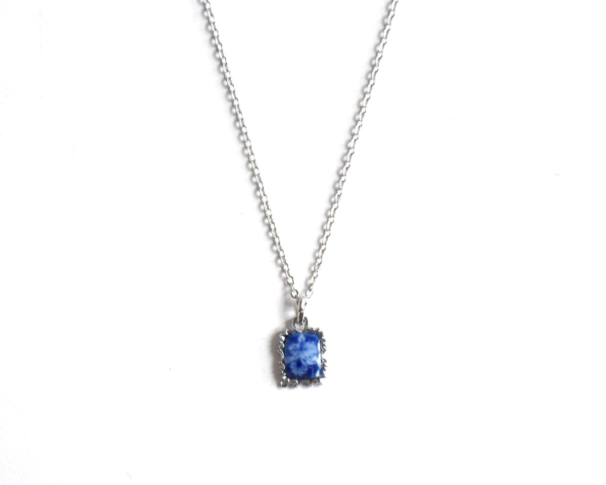 Kiyomizu-Yaki porcelain pendant cobalt white floral necklace on a white background