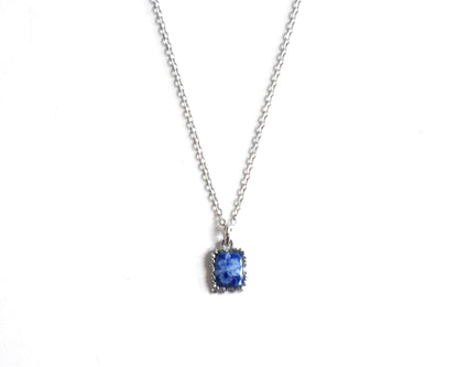 Kiyomizu-Yaki porcelain pendant cobalt white floral necklace on a white background