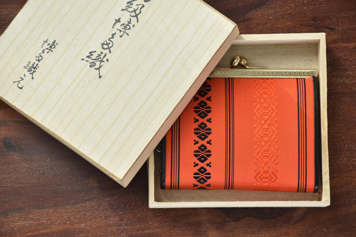 Vermilion Hakata-Ori Silk Clasp Coin Purse inside its wooden storage box with Japanese calligraphy inscription on the lid
