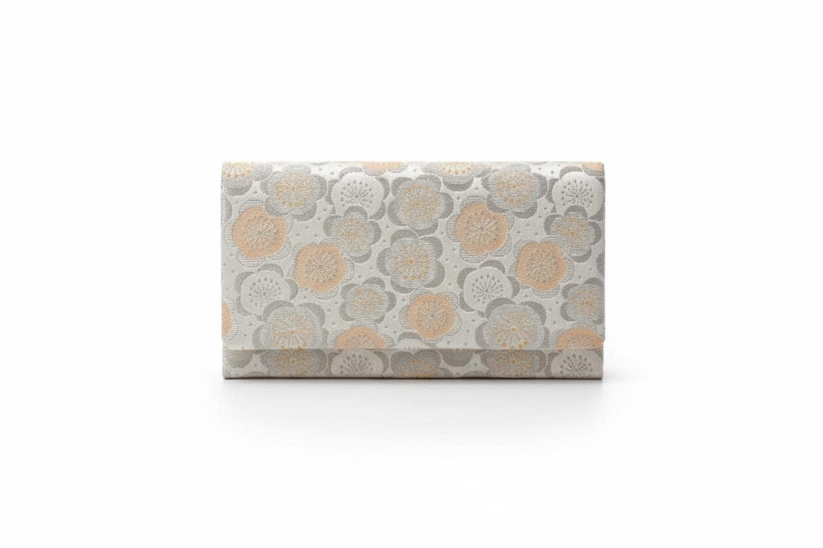 Nishijin-Ori silk clutch front view showing the plum blossom motif on a white background