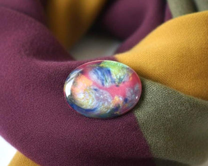 Kutani-Yaki Oval Ceramic Brooch Multicoloured Glaze pinned on a purple, olive, and mustard scarf