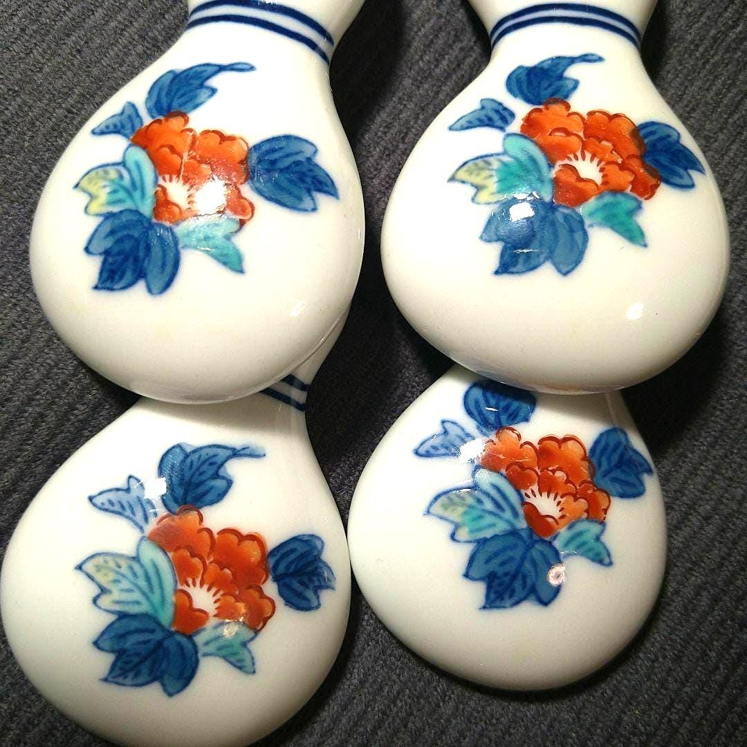 Porcelain gourd chopstick rests close up of the hand painted floral enamel pattern