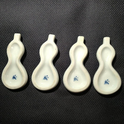 Porcelain gourd chopstick rests bottom bases showing the hollow shape and blue mark