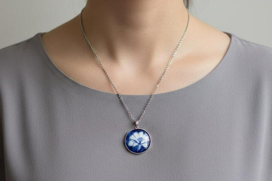 Kiyomizu-Yaki Porcelain Pendant Blue Floral necklace worn on a person, featuring a handcrafted Japanese ceramic pendant