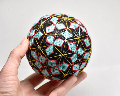 Hand-Embroidered Japanese Temari Ball Folk Art table scatter shown in size next to a hand
