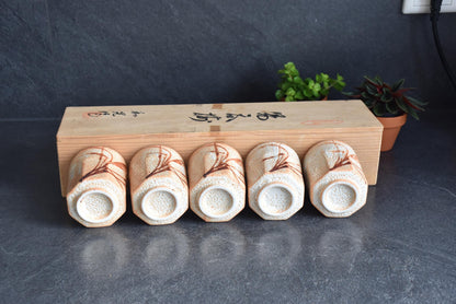 Shino-Yaki Yunomi Tea Cup Set Of 5 With Kiribako Box showing bases aligned in front of the storage box