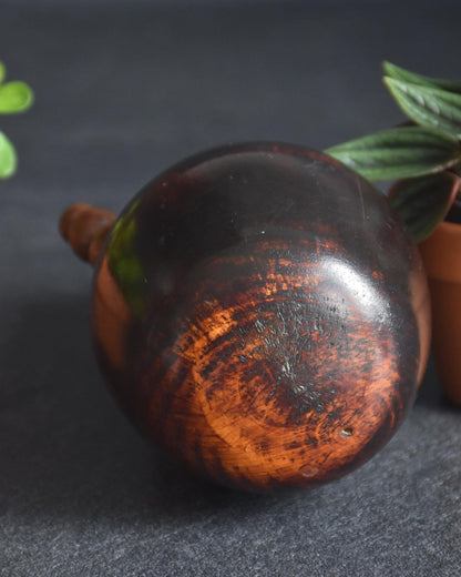 Mitsuo sosaku kokeshi doll top view showing rounded head and wood grain
