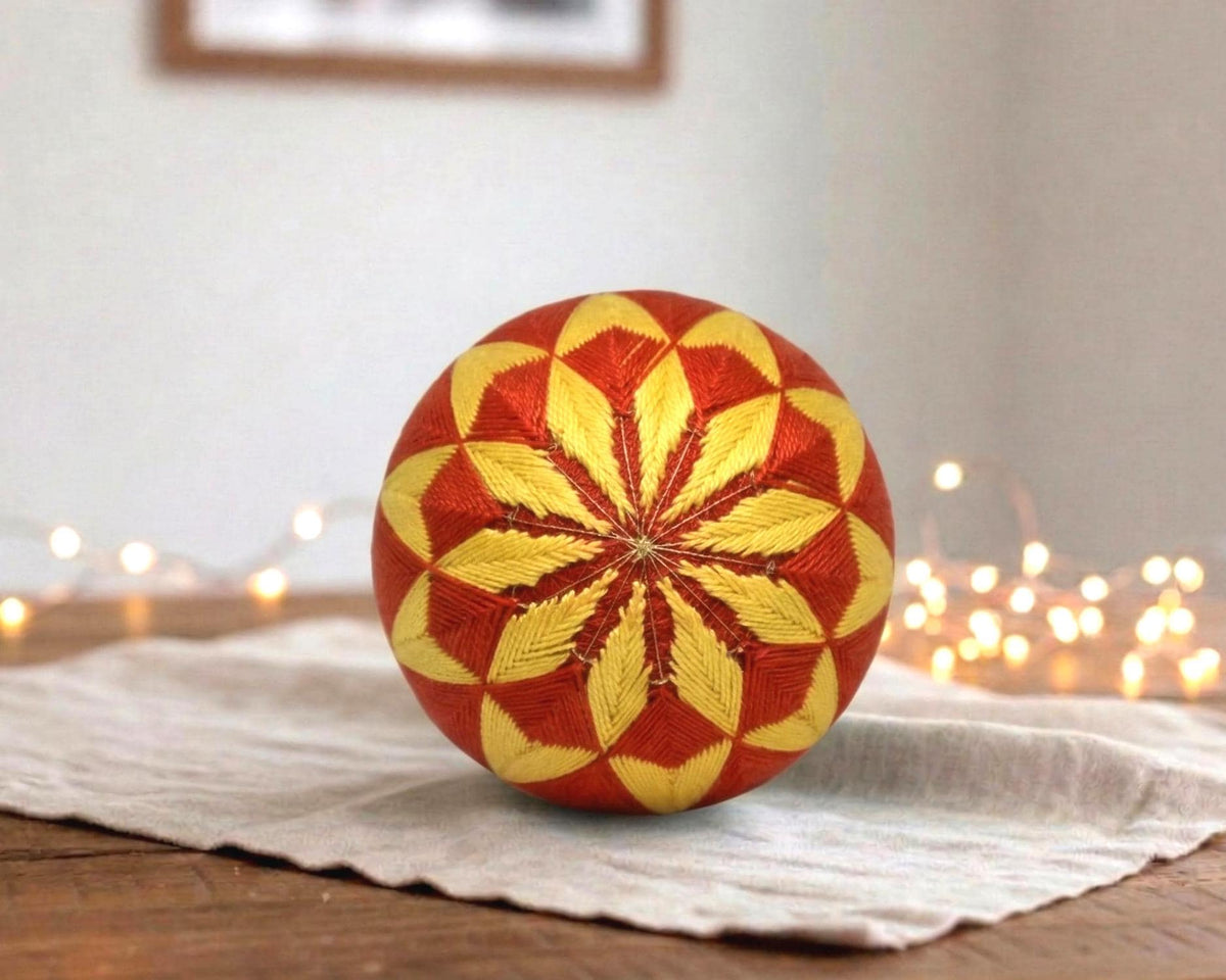Hand-Embroidered Japanese Temari Ball Folk Art table scatter displayed on a linen cloth