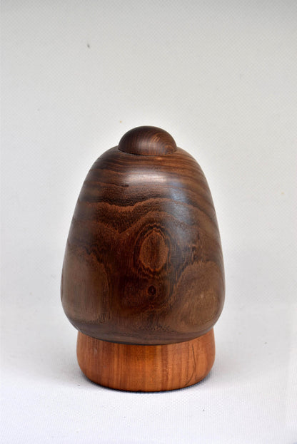 Daisuke Takeda Sosaku Kokeshi showing the rounded back view of the doll with the pine motif