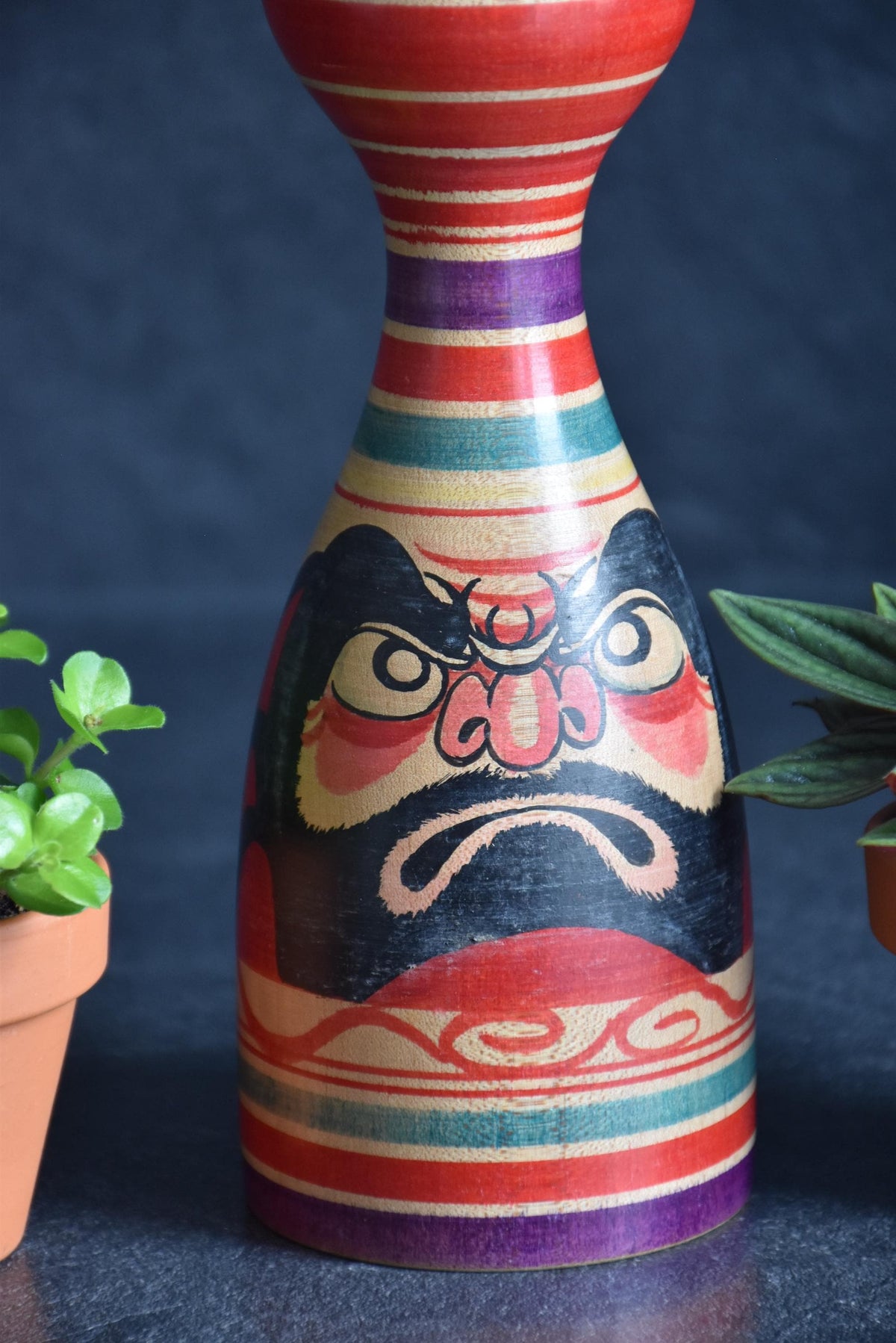 Senzo Mori Tsugaru kokeshi doll close up of the red peony motif on the body