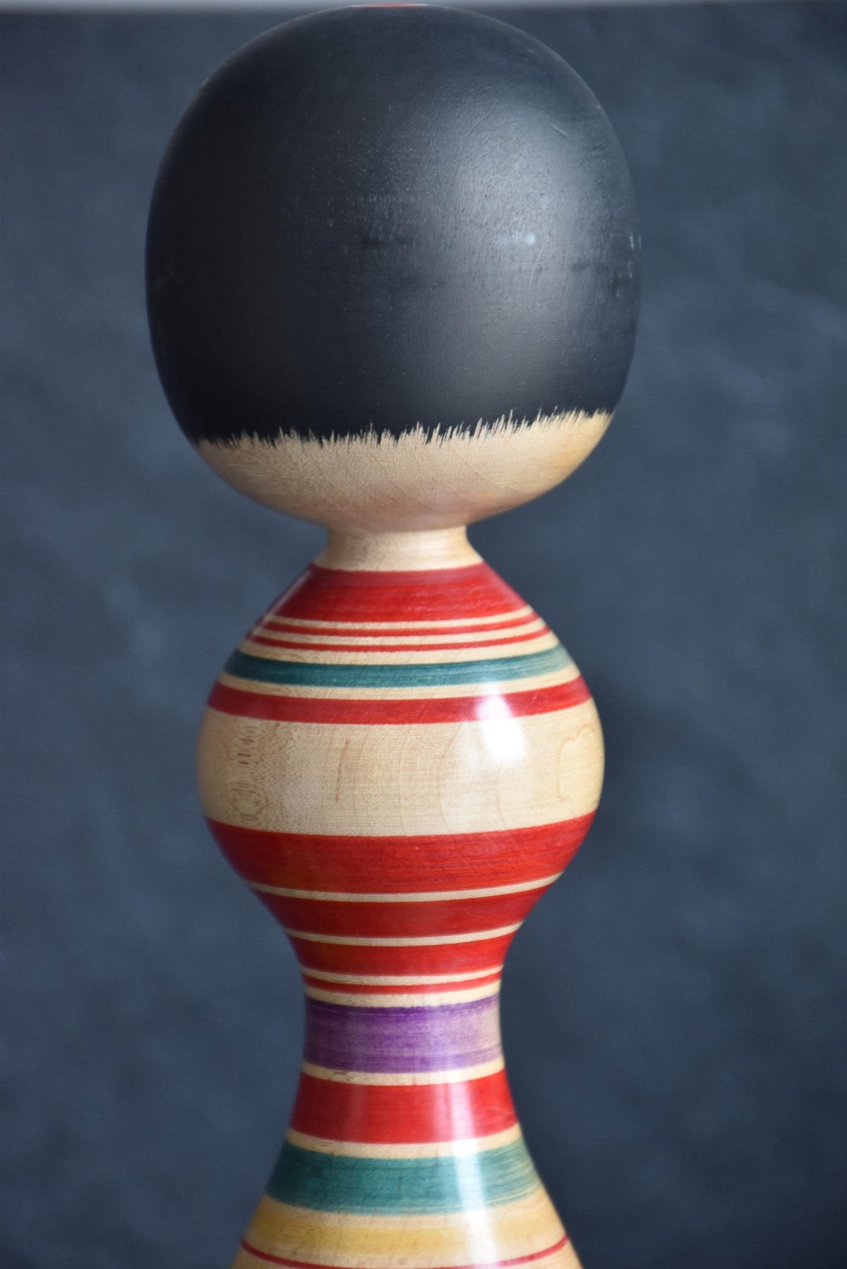 Senzo Mori Tsugaru kokeshi doll close up of the head and upper body rings
