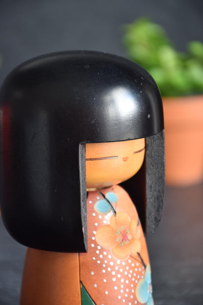 Sogen Sosaku Kokeshi Haru No Otozure Plum Blossom close up on the upper body, face, and painted plum blossom details