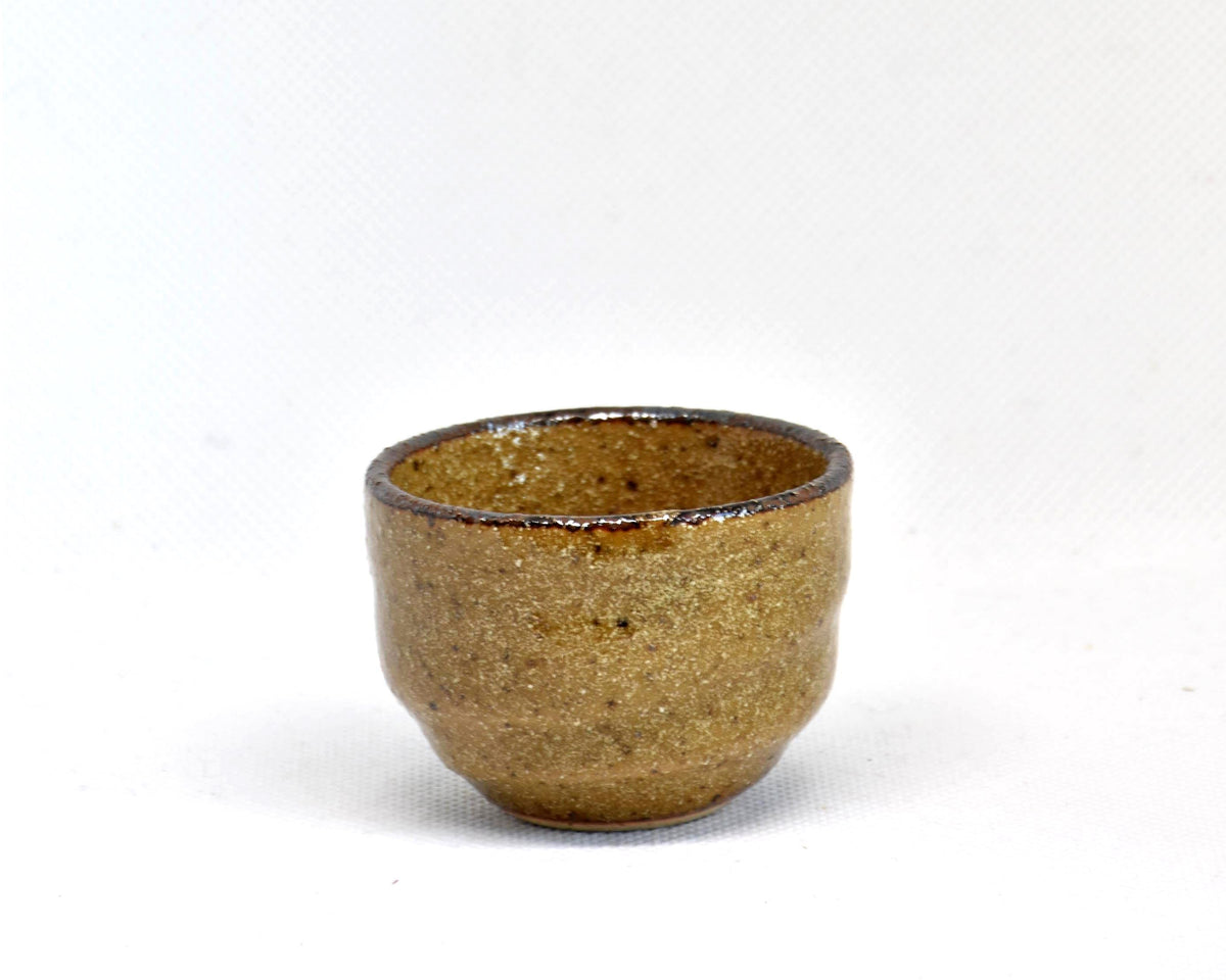 Karatsu ware guinomi sake cup, single ceramic cup showing glossy finish