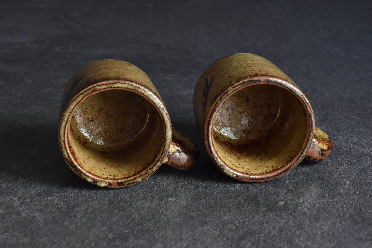 Karatsu-yaki coffee cups looking straight down into the ceramic interiors