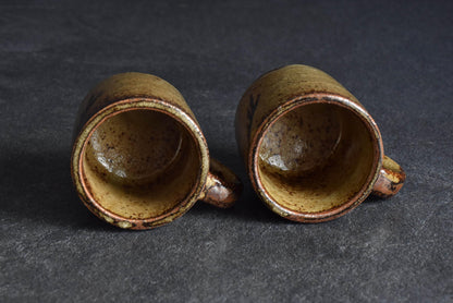 Karatsu-yaki coffee cups looking straight down into the ceramic interiors