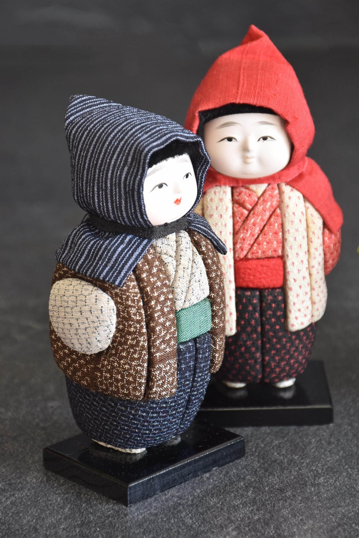Shiozawa Omeshi Ningyo Pair Traditional Fabric Dolls angled closeup showing the hand painted face